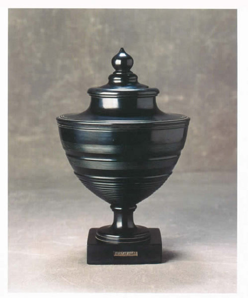 A very rare Regency Cannel Coal Urn with a reversible candlestick in the lid, marked on the foot with a tin label of the maker: 'W Malpas'